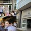 Montagem de 3 fotos. João Campos falando em microfone ao redor de pessoas. João Campos abraça pessoa. Fachada da Secretaria da Fazenda
