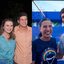 2 FOTOS. Miguel Coelho, Marília Arraes e João Campos com roupas xadrez sorriem abraçados. Foto 2 Raquel Lyra e Miguel Coelho molhados sorriem abraçados