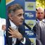 Montagem com Lula, Aécio e Flávio lado a lado