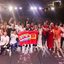 victor marques teresa leitão humberto costa joão campos silvio costa filho e outros sorriem em palco de teatro segurando bandeira escrito Lula 13